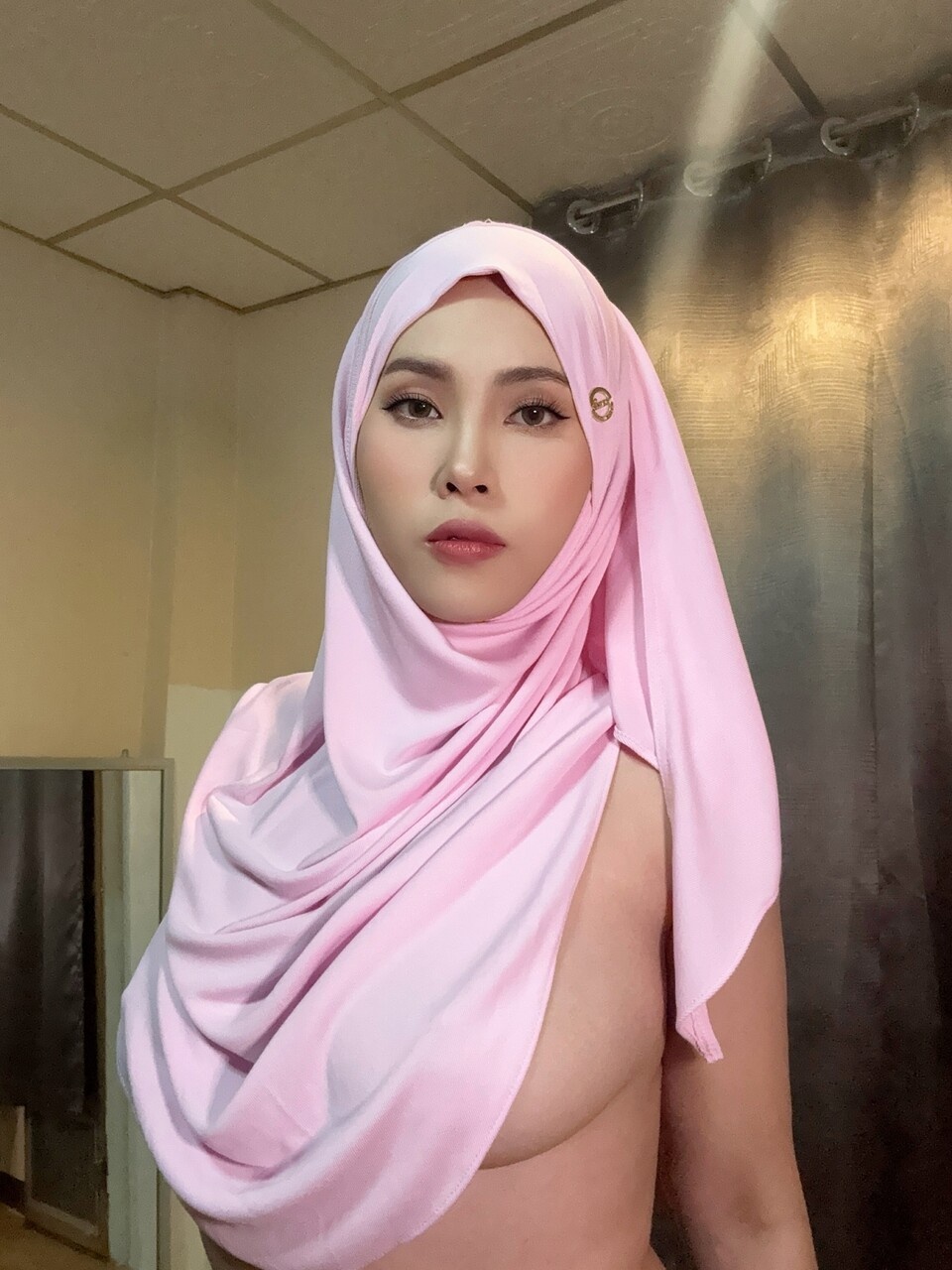 Curvy hijab hottie posing topless, showing off perfect breasts. photo 3
