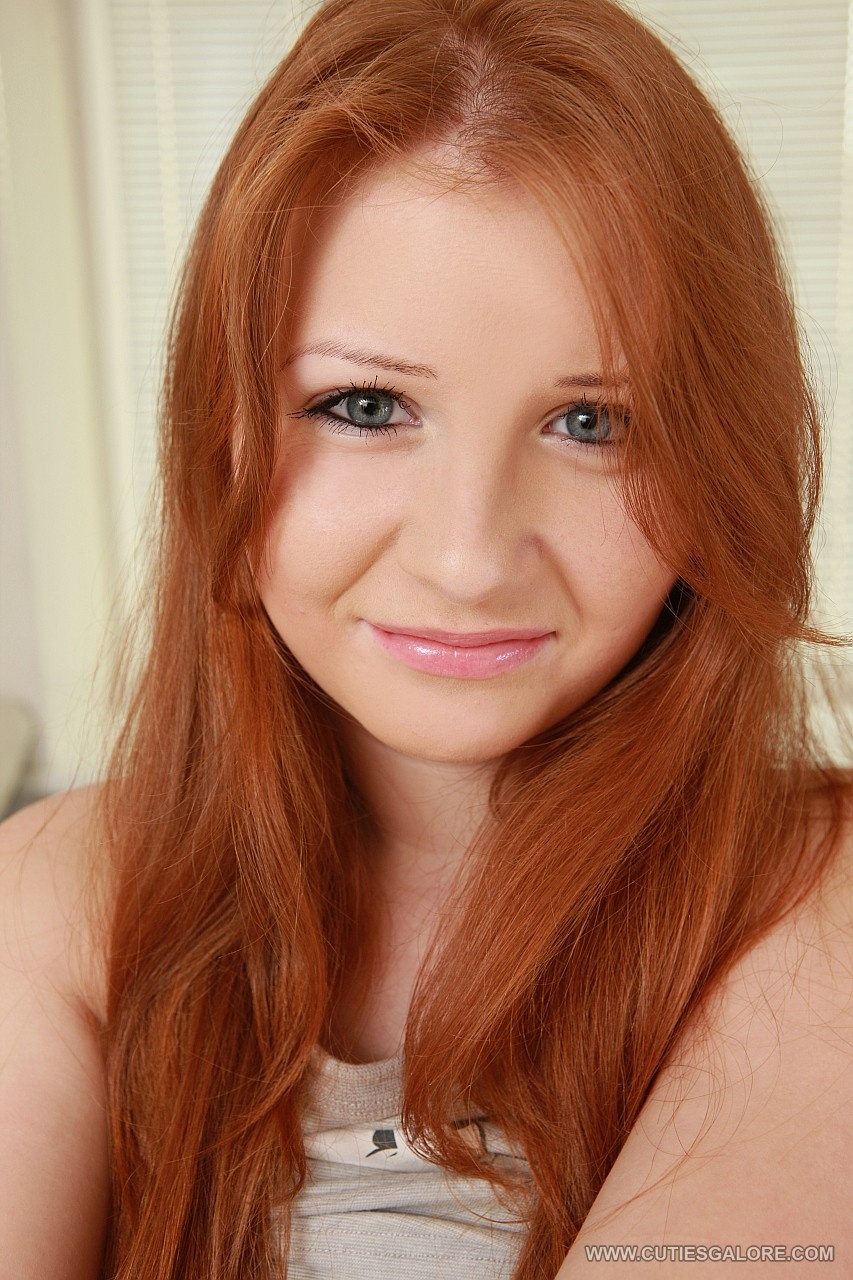 Redhead spreading her wet cunt and ass for the camera. photo 3