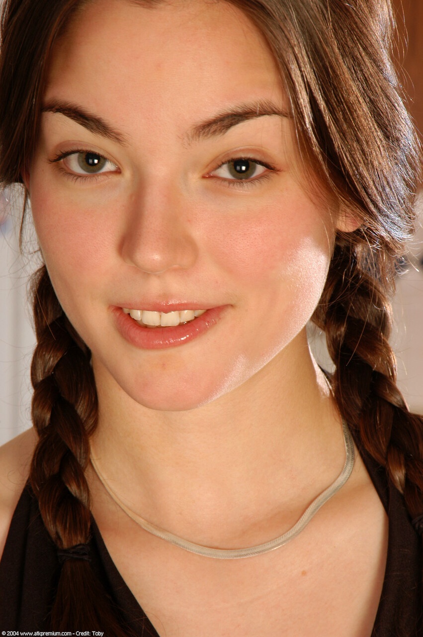 Brunette spreading her hairy wet pussy with seductive smile. photo 1