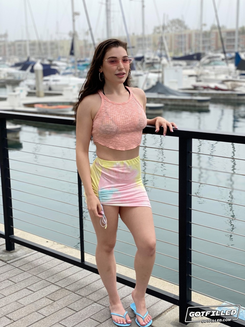 Rainbow bikini barely covering big tits and juicy ass. photo 1
